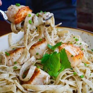 Scallops Over Truffled Fettucine